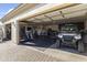 Garage converted into a home gym, with various equipment and flooring at 18223 W Rancho Ct, Litchfield Park, AZ 85340