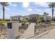 House front with a stone facade and nicely landscaped walkway at 18223 W Rancho Ct, Litchfield Park, AZ 85340