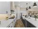 Modern kitchen with white cabinets and large island at 18223 W Rancho Ct, Litchfield Park, AZ 85340