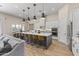 Modern kitchen with large island and white cabinetry at 18223 W Rancho Ct, Litchfield Park, AZ 85340