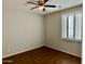 Cozy bedroom with hardwood floors and a bright window at 20980 N Sweet Dreams Dr, Maricopa, AZ 85138