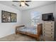 Bright bedroom with a window, comic book decor, and comfortable bed, ideal for relaxation and personal style at 3930 S 58Th Ln, Phoenix, AZ 85043