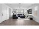 Inviting living room featuring tile floors, a ceiling fan and a comfortable sectional sofa at 3930 S 58Th Ln, Phoenix, AZ 85043