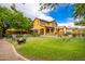 Expansive backyard with lush lawn, patio seating, and an outdoor entertainment area at 9301 E Desert Arroyos --, Scottsdale, AZ 85255