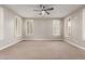 Spacious bedroom featuring plush carpet, ceiling fan and shuttered windows for ample light control at 9301 E Desert Arroyos --, Scottsdale, AZ 85255