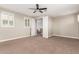 Bedroom with carpet, ceiling fan, plantation shutters, and open door frame at 9301 E Desert Arroyos --, Scottsdale, AZ 85255