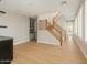 A well-lit hallway showcasing hardwood floors, a staircase, and custom built-in cabinets at 9301 E Desert Arroyos --, Scottsdale, AZ 85255