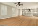 An expansive living room with hardwood floors and a view of the kitchen with modern cabinets at 9301 E Desert Arroyos --, Scottsdale, AZ 85255