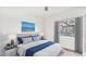 Comfortable bedroom featuring a plush bed with soft blue accents and bright natural light at 13778 E Charter Oak Dr, Scottsdale, AZ 85259