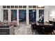 Elegant dining room with stylish furnishings and open shutters to the outside at 13778 E Charter Oak Dr, Scottsdale, AZ 85259