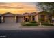 Charming home exterior with a well-manicured lawn and desert landscaping at 13778 E Charter Oak Dr, Scottsdale, AZ 85259