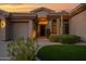 Inviting home entrance with well-maintained landscaping and desert accents at 13778 E Charter Oak Dr, Scottsdale, AZ 85259