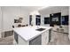 Modern kitchen features a large island, stainless steel appliances, and open concept design at 13778 E Charter Oak Dr, Scottsdale, AZ 85259