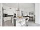 Bright kitchen features stainless steel appliances, marble countertops and an island with barstool seating at 13778 E Charter Oak Dr, Scottsdale, AZ 85259