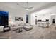 Spacious living room with open floor plan, modern lighting, and neutral color palette at 13778 E Charter Oak Dr, Scottsdale, AZ 85259