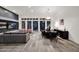 Open living and dining area with modern decor, neutral tones, and outdoor views at 13778 E Charter Oak Dr, Scottsdale, AZ 85259
