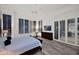 Tranquil main bedroom with shutters and doors to backyard patio at 13778 E Charter Oak Dr, Scottsdale, AZ 85259