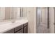 Bathroom with double vanity and a large mirror at 18206 W Sells Dr, Goodyear, AZ 85395