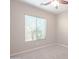 Bright bedroom with carpeted floors and a window with blinds at 18206 W Sells Dr, Goodyear, AZ 85395