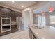 Modern kitchen with stainless steel appliances and dark cabinets at 18206 W Sells Dr, Goodyear, AZ 85395