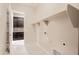 Laundry room with built-in shelving and cabinets at 18206 W Sells Dr, Goodyear, AZ 85395