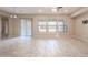 Bright living room with tile floors and large windows at 18206 W Sells Dr, Goodyear, AZ 85395