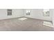 Large bedroom with carpeted floor and multiple windows at 18428 W Poston Dr, Surprise, AZ 85387