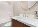 Stylish bathroom with a modern vanity, sleek faucet, and a shower-tub combination for versatile bathing options at 11301 N Northfield St, Surprise, AZ 85388