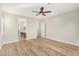 Spacious main bedroom featuring wood floors and an ensuite bathroom at 11301 N Northfield St, Surprise, AZ 85388