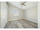 Bright bedroom with wood-look floors and ample closet space at 14535 W Zuni Trl, Surprise, AZ 85374