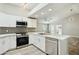 Modern kitchen with white cabinets and stainless steel appliances at 14535 W Zuni Trl, Surprise, AZ 85374