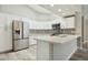 Modern kitchen with white cabinets and stainless steel appliances at 14535 W Zuni Trl, Surprise, AZ 85374