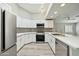 Modern kitchen with white cabinets and stainless steel appliances at 14535 W Zuni Trl, Surprise, AZ 85374