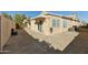 Backyard patio with covered area and water feature at 14535 W Zuni Trl, Surprise, AZ 85374