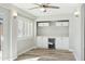 Stylish wet bar with white cabinets and wine cooler at 14535 W Zuni Trl, Surprise, AZ 85374