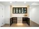 Dining area featuring wooden cabinets, marble countertop, and wine refrigerators at 7117 E Rancho Vista Dr # 5003, Scottsdale, AZ 85251