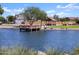 Relaxing lakefront gazebo with a wooden dock and scenic views at 37375 W Patterson St, Maricopa, AZ 85138