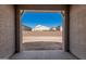 A large backyard with a clear blue sky, awaiting personalization and landscaping at 11942 W Parkway Ln, Avondale, AZ 85323