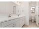 Bathroom featuring double sinks with large mirrors and modern lighting at 11942 W Parkway Ln, Avondale, AZ 85323