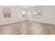 Bright bedroom with luxury vinyl plank flooring and ample natural light from multiple windows at 11942 W Parkway Ln, Avondale, AZ 85323