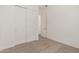 Bedroom featuring neutral carpet and a closet for storage space at 11942 W Parkway Ln, Avondale, AZ 85323