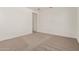 Bedroom with carpeted flooring and white walls, featuring a doorway at 11942 W Parkway Ln, Avondale, AZ 85323