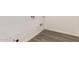 This laundry room features wood-look flooring and hook-ups for a washer and dryer at 11942 W Parkway Ln, Avondale, AZ 85323