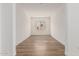 Spacious room with wood flooring, white walls, and natural lighting at 11942 W Parkway Ln, Avondale, AZ 85323
