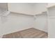 A spacious walk-in closet with shelving and carpeted flooring at 11942 W Parkway Ln, Avondale, AZ 85323