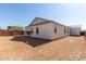 Rear exterior of the home showing the backyard and covered patio at 11934 W Parkway Ln, Avondale, AZ 85323