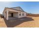 Exterior view of the house, featuring a covered patio and backyard at 11934 W Parkway Ln, Avondale, AZ 85323