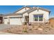 Charming single-Gathering home with well-maintained landscaping in front yard at 11934 W Parkway Ln, Avondale, AZ 85323