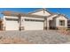 Charming home with a three car garage and patterned brick driveway at 11934 W Parkway Ln, Avondale, AZ 85323