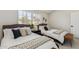 Cozy bedroom featuring two beds, a window with shutters, and decorative accents at 3059 E Rose Ln, Phoenix, AZ 85016